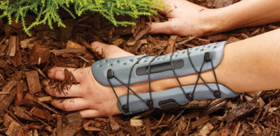 Person gardening, wearing a Tensor™ Water Resistant Wrist Brace
